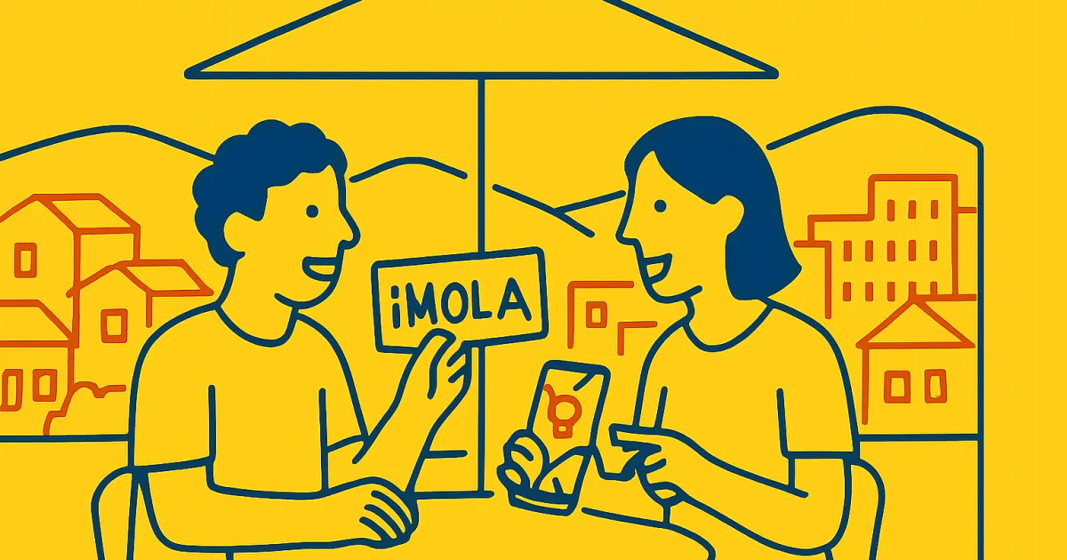 Two people talking at a Medellín café with a phone map and phrase card, in Colombian flag colors